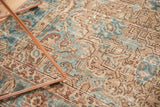 Even wear reveals Rococo-influenced curvilinear motifs in blue and camel on Heriz rug.