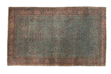 Distressed antique Kerman rug; aqua blue field, intricate vinery, dark burgundy borders. 4x7.