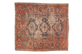 Antique Caucasian Soumac fragment, three navy medallions on a cherry red field with paneled borders.