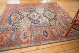 Fragmented antique Caucasian Soumac rug with triple medallion, cherry red, navy, and foundation patina.