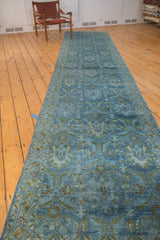 Distressed vintage Hamadan runner, highlighting faded denim blue pile and worn palmette motifs.
