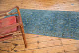 Distressed vintage Hamadan runner with worn blue pile and subtle sprawling palmette motif.