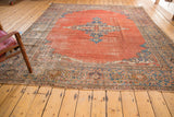 Antique Mahal carpet's sky blue curvilinear corner spandrel and faded purple border.