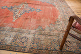 Corner of antique Mahal carpet, featuring worn madder root red field and faded blue spandrel.