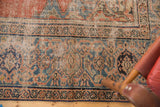 Antique Mahal carpet showcasing madder red, sky blue, and foundation wear on floral pattern.