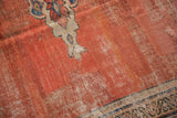 Antique Mahal carpet detail: Madder root red field with ivory spandrel and visible wear to knot heads.
