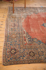 Antique Mahal carpet corner: worn madder root red field, curvilinear sky blue spandrel, intricate borders.