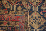 Antique Soumac flat-weave detail: geometric navy blue, red, ivory patterns, and secured selvage.