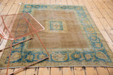 Distressed Agra rug wide border, serrated leaf motif in sky blue and dusty gold.