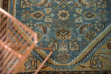 Distressed Hamadan runner with worn herati motif in sky blue, pale gold, and chocolate brown.