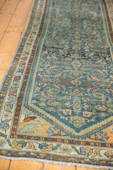 Distressed Persian Hamadan runner detail, herati motif, floral border, muted blue and gold.