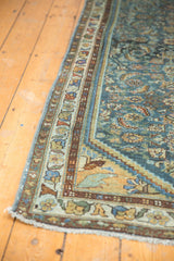 Distressed Hamadan runner corner, blue herati pattern, decorative meandering vine border, light fringe.