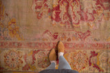 Vintage Oushak carpet border and field with pale gold and black cherry red motifs.