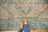 Distressed Heriz carpet with worn geometric pattern in powder blue and pale camel.