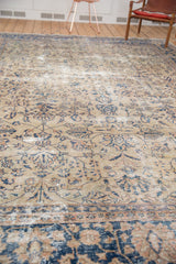 Distressed vintage Sparta carpet, floral and tendril motif in navy, ivory, mostly even wear.