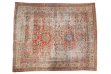 Distressed antique Mahal carpet, oversize floral palmettes in madder red, sky blue, and sand.