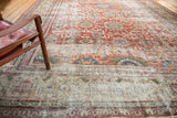 Distressed antique Persian Mahal carpet, showcasing madder root red field and sand floral border.