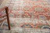 Distressed antique Mahal carpet field with madder root red, low pile, and prominent floral palmettes.