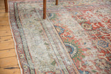 Distressed antique Mahal carpet: worn pile, madder red field, sky blue floral border motifs.