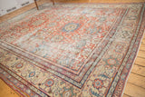 Antique Mahal carpet detail, revealing distressed madder red field, sky blue palmettes, and sand border.