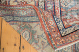 Antique Mahal rug with distressed madder red pile and visible hand-knotted foundation.