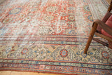 Distressed floral field and ornate camel border of an antique Mahal carpet, circa 1920s.