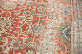 Madder root red and sand field with distressed texture, showing antique Mahal floral palmettes.