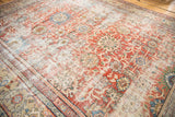 Antique distressed Mahal carpet with allover floral palmettes, madder red and faded tones.