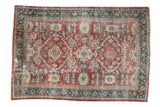 Vintage Distressed Mahal carpet with brilliant ruby red field, intricate floral pattern, and time-softened tones, 7x10.
