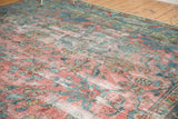 Vintage distressed Mahal rug detail: allover faded cranberry, dusty teal, gold vinery, and worn texture.
