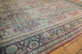 Vintage Distressed Mahal carpet's textured pile with faded floral palmettes in red, teal, ivory.