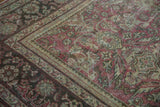 Distressed Mahal carpet border and faded field showing red, green, and ivory floral motifs.