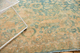 Sky blue, camel gold scrolling motifs on vintage Khorassan carpet with worn pile.