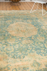 Worn sky blue and camel gold Kashmar vase motifs on vintage Khorassan rug.