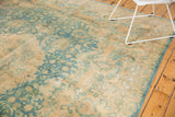 Scrolling islimis and palmettes in faded sky blue and camel, with mostly even wear.