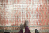Distressed Malayer runner with worn red field, white foundation, and powder blue border.
