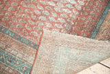 Hand-knotted Malayer rug, with folded corner revealing foundation and distressed pile.