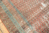 Distressed antique Malayer rug texture, featuring worn mir boteh, faded blue, and exposed foundation.