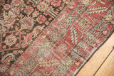 Worn red serrated leaf border and faded dark brown herati field on the antique Karabagh rug.