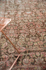 Distressed antique Karabagh rug showcasing its herati motif with a richly worn aesthetic.