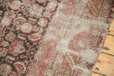 Worn knot heads and exposed light foundation on a distressed Karabagh runner.