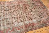 Close-up of distressed Karabagh runner showing worn herati pattern and exposed foundation.