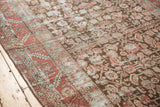 Distressed Karabagh runner detail with faded herati motif and worn serrated border.