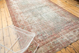 Distressed vintage Mahal runner with faded Herati field and intricate boteh border.