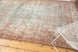 Distressed vintage Mahal rug corner with visible foundation, showing intricate meandering boteh border and faded colors.