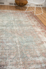 Distressed vintage Mahal rug runner, showcasing faded Herati pattern with pale blue and blush tones and visible foundation.