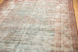 Textural detail of a distressed Mahal runner, showcasing its worn pile and visible foundation.