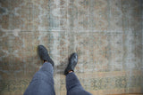 Tone-on-tone distressed vintage Agra carpet showing wear to knot heads and visible foundation.