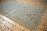 Vintage Distressed Agra carpet pile, showing mostly even wear, exposed foundation, and secured side.