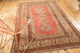 Textured distressed Malayer rug with cranberry field, powder blue diamonds, and classic patterned border.
